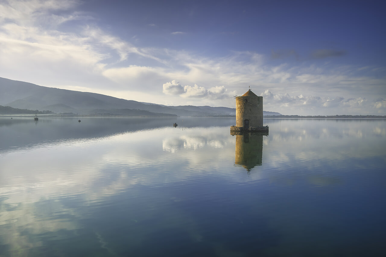 The crazy view of a Spanish Mill in the Orbetello lagoon