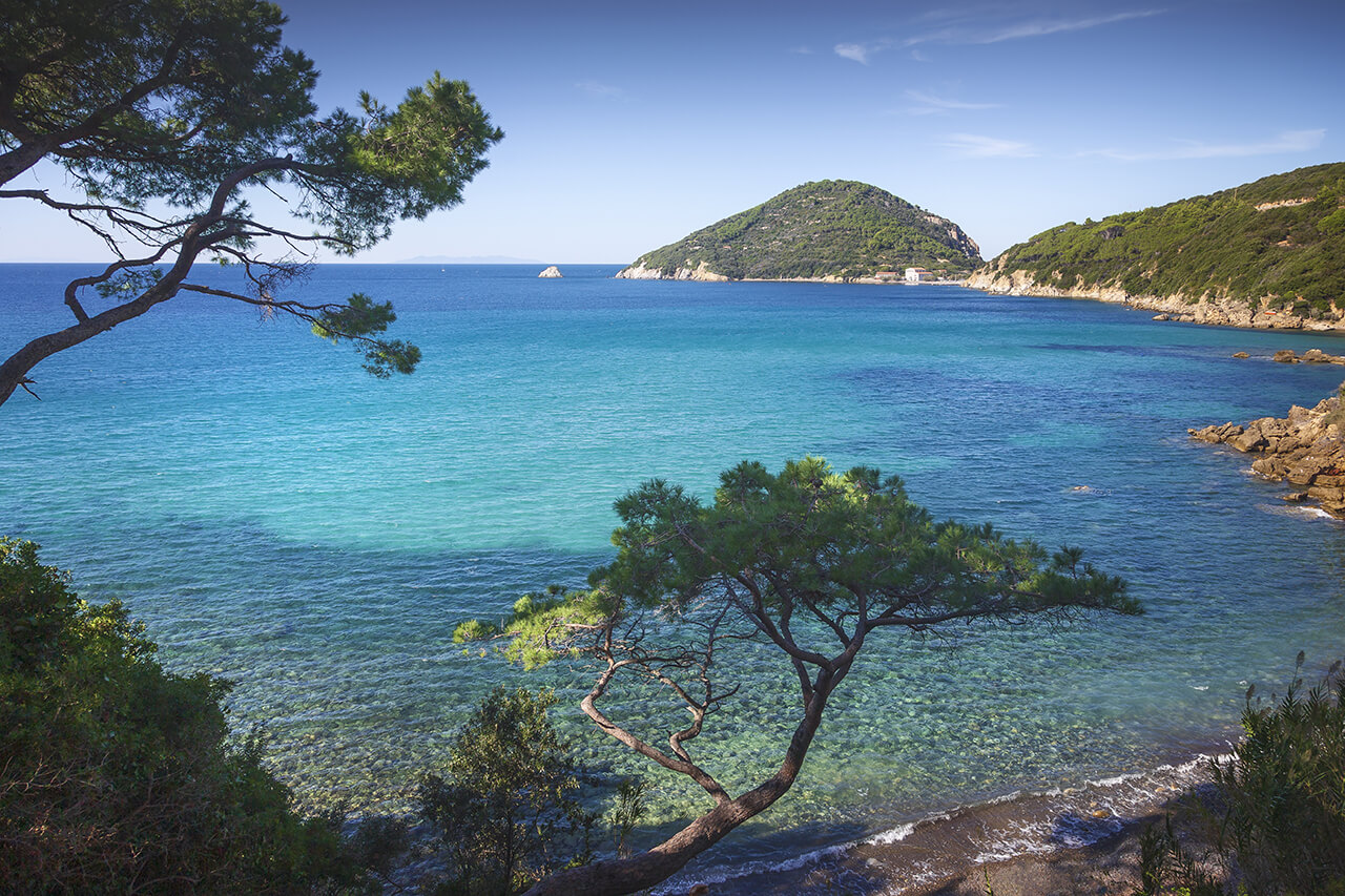 Above view of the Elba Island with beautiful mountains and crystal clear water beach.