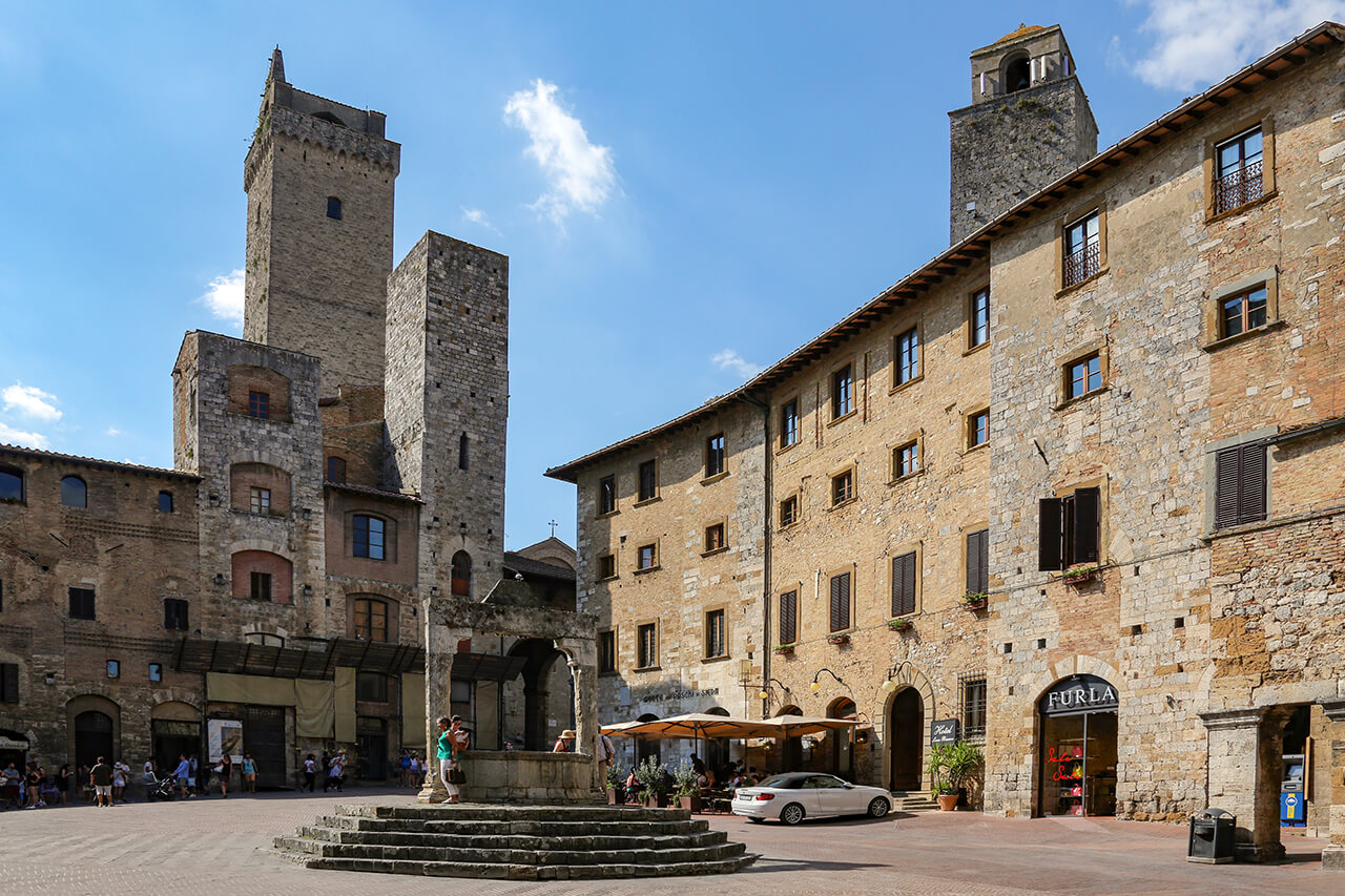 Visit San Gimignano in March to see its medieval architecture & famous towers. Built by wealthy families, only 14 out of the original 72 remain.
