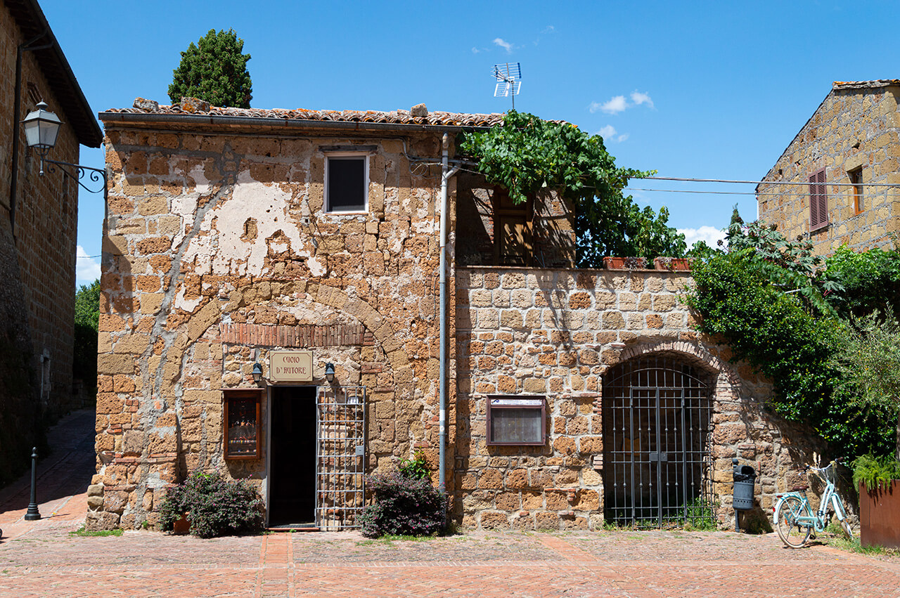 An old and historical building in the narrow streets of Sovana, Tuscany