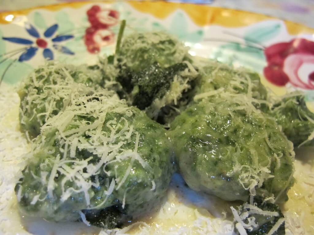 Gnudi (Tuscan pasta) served with butter, sage, and parmesan cheese