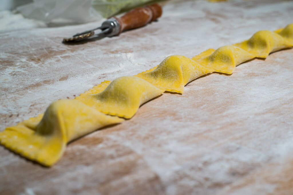 The process of making tortelli, usually larger in Maremma