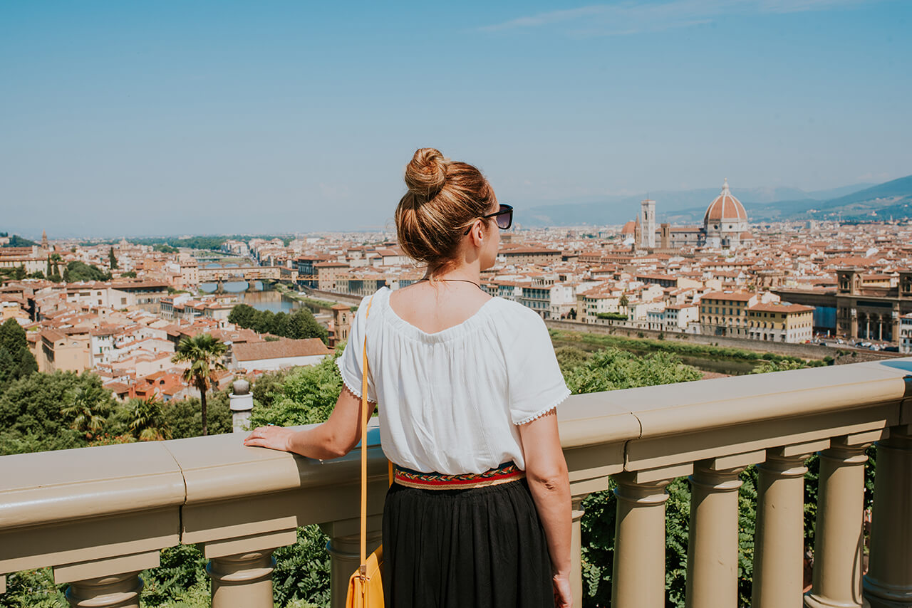 In the summer, a tourist enjoys the sights of Florence