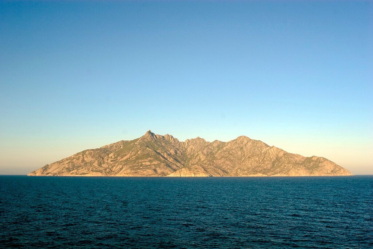 A photo shows the north side of the island of Montecristo