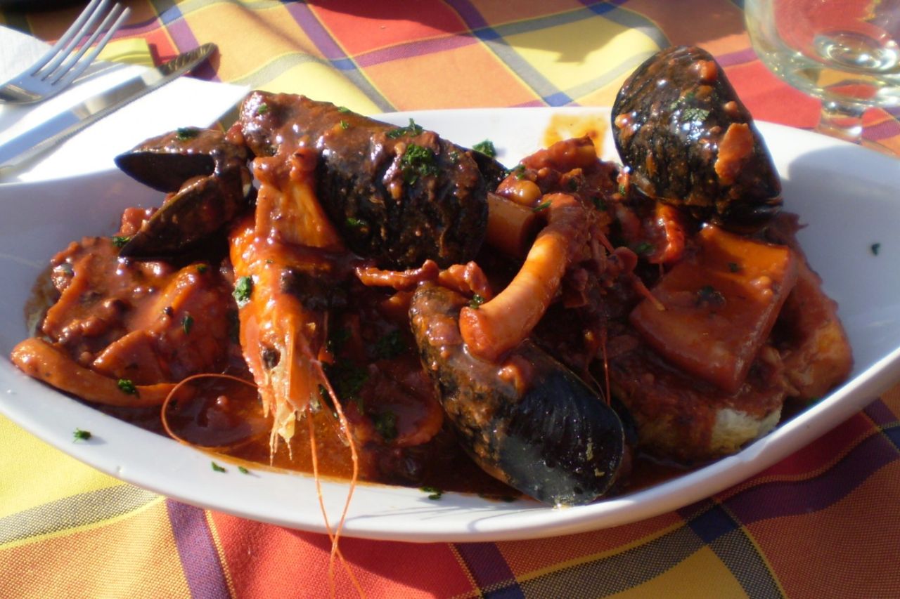 A plate of Caciucco served in a restaurant in Livorno, Tuscany