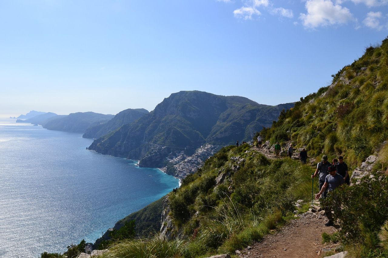 A hiker walks along the path of the gods - Amalfi Coast