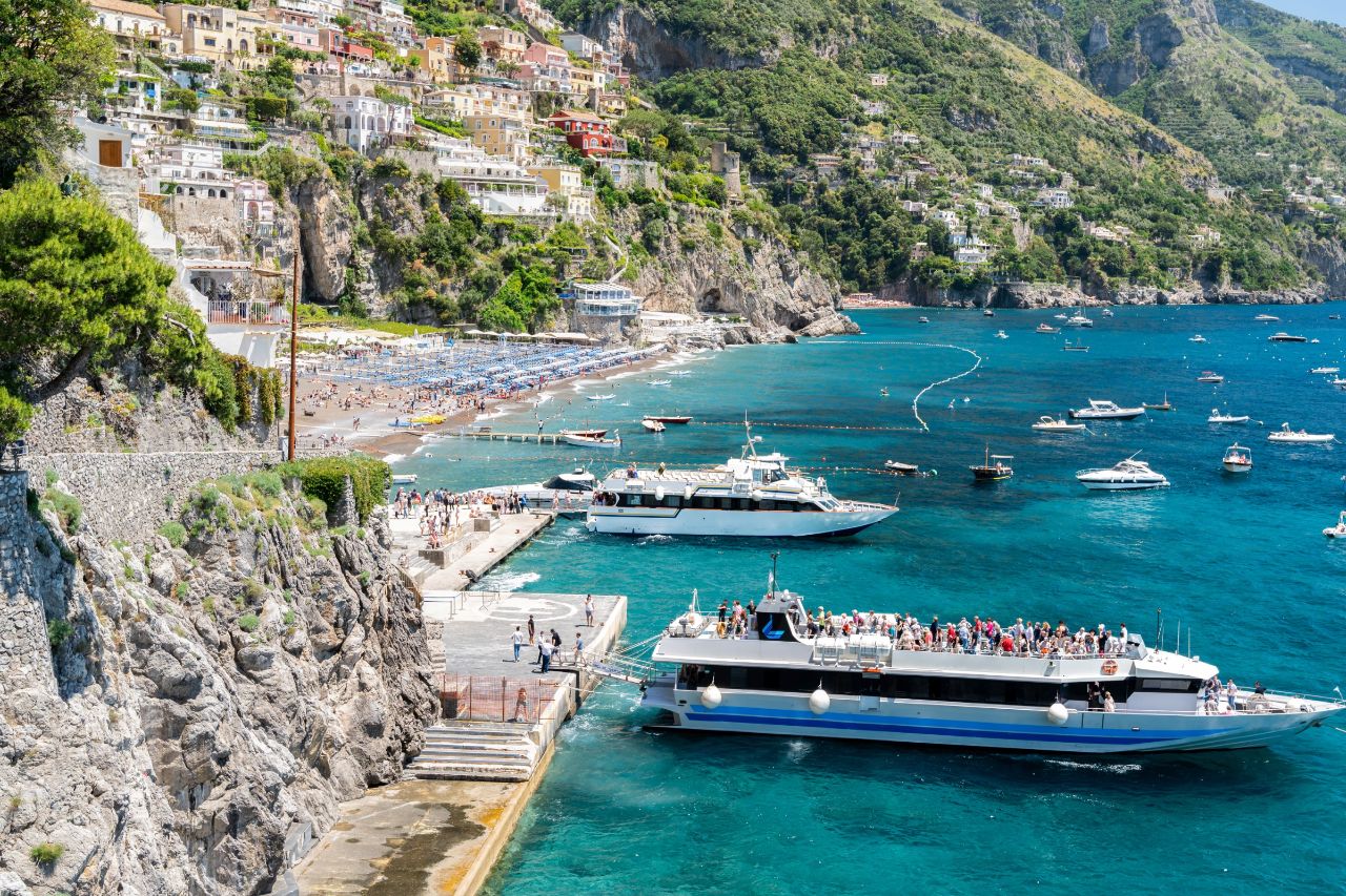 Boats are transporting tourists to Marina di Praia, one of the best beaches on the Amalfi coast