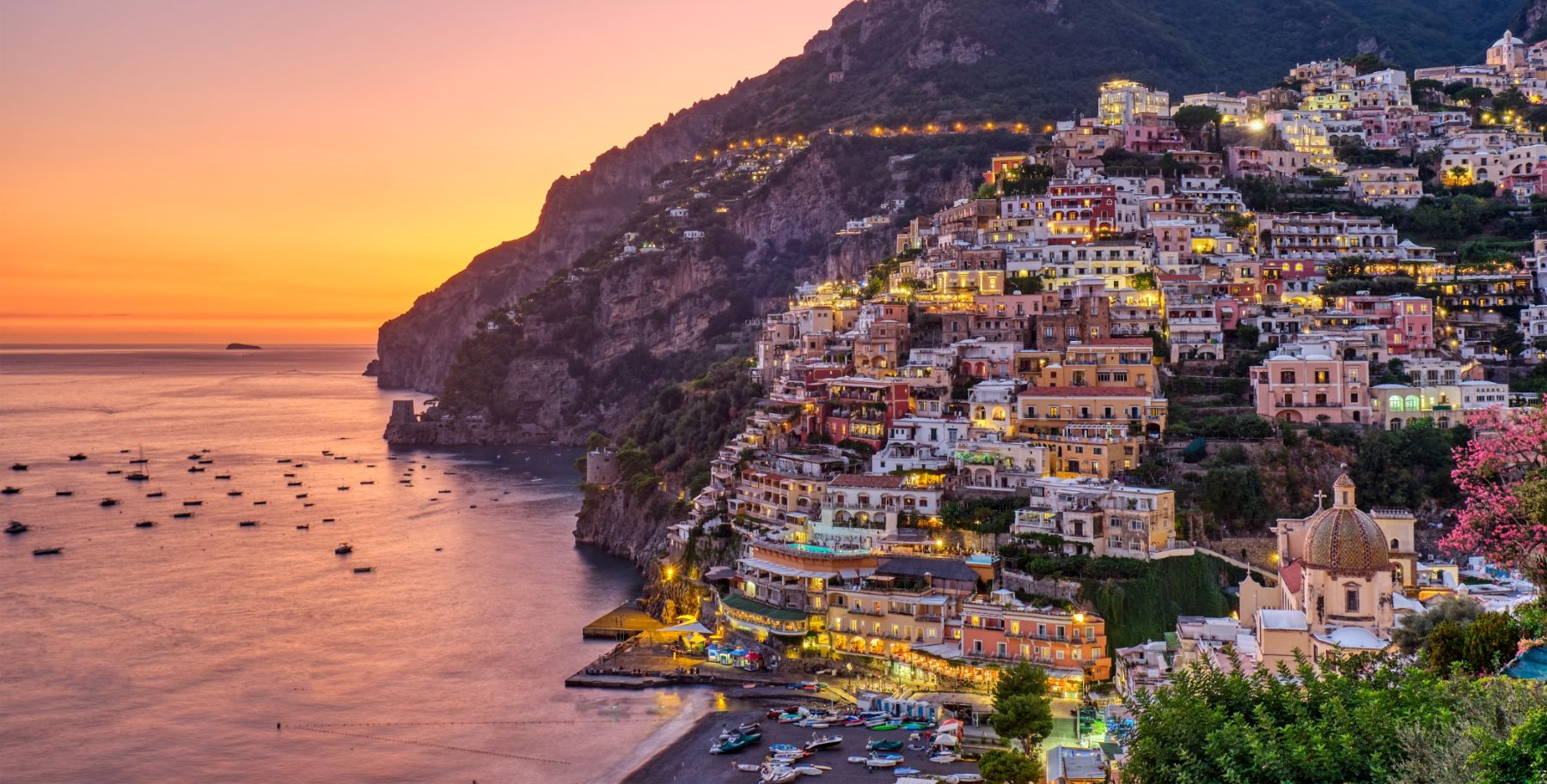 Sunset over a town included in the Amalfi coast itinerary