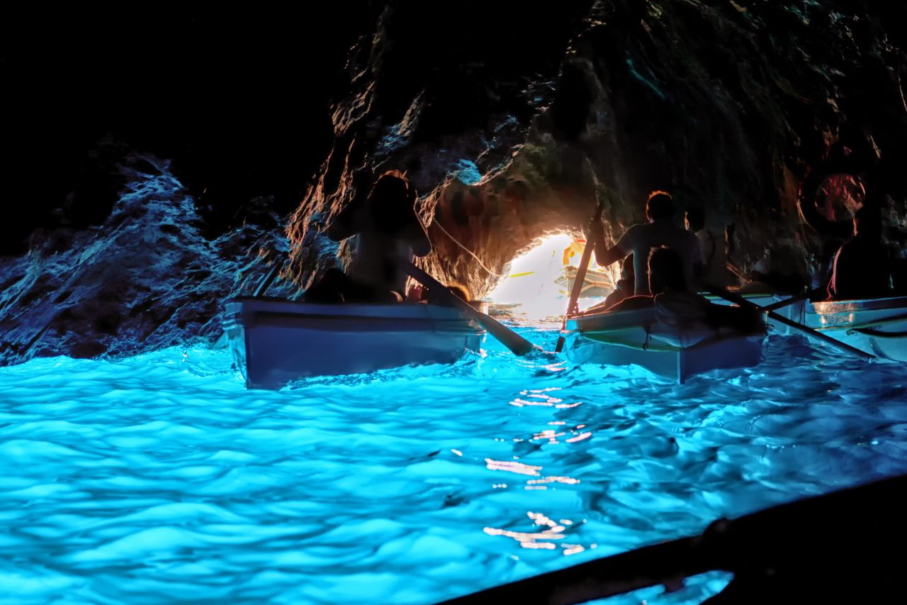 An exploration of the Blue Grotto near the island of Capri by tourists