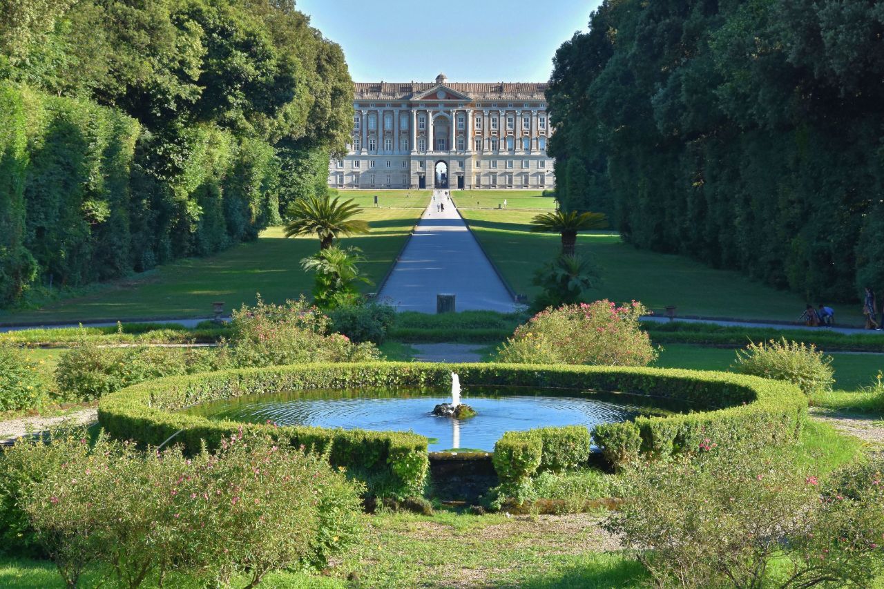 In this picture, the Royal Palace of Caserta has seen surrounded by greens.