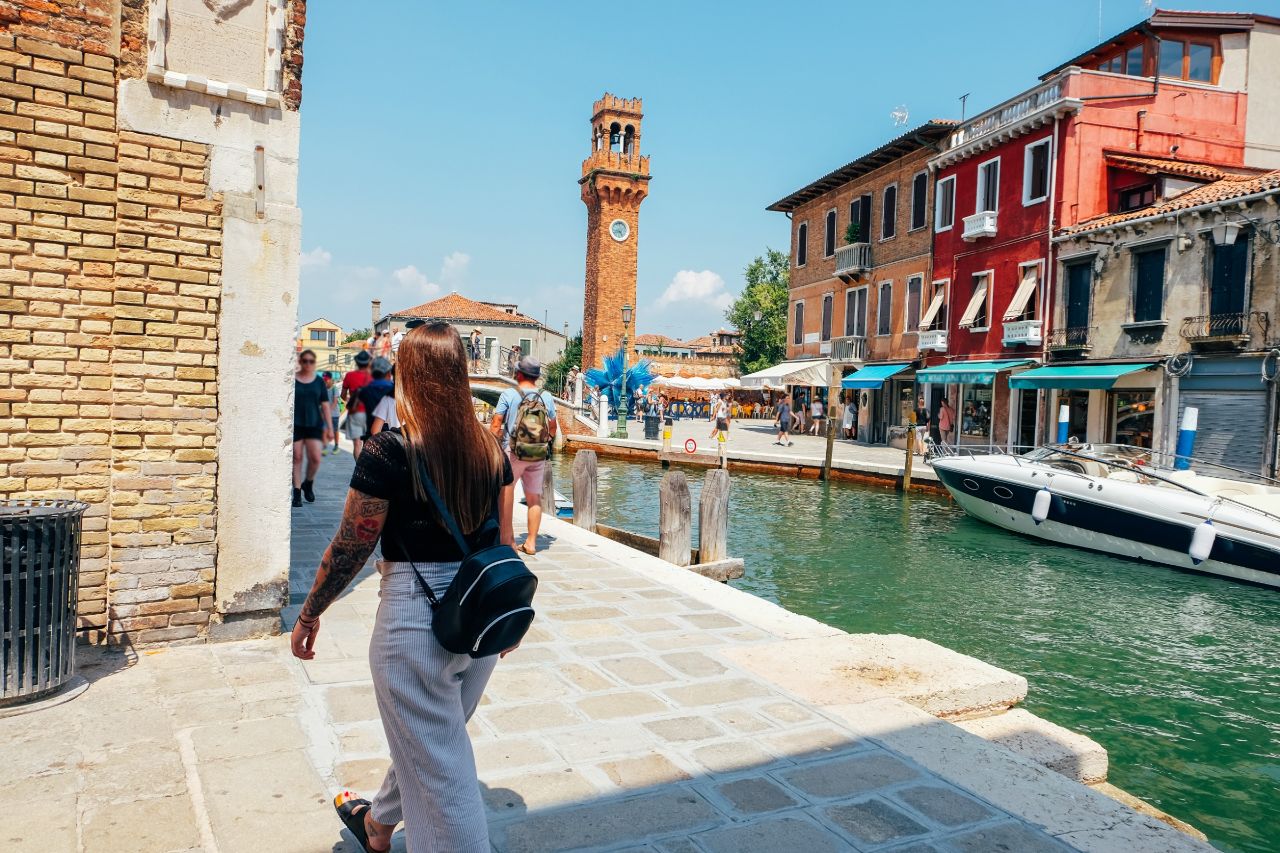 Tourist walking and enjoying the view in Murano, Near Venice