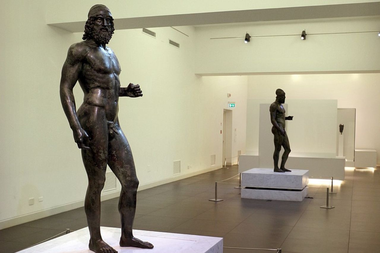 The Riace Bronzes, naked statues of Greek warriors.