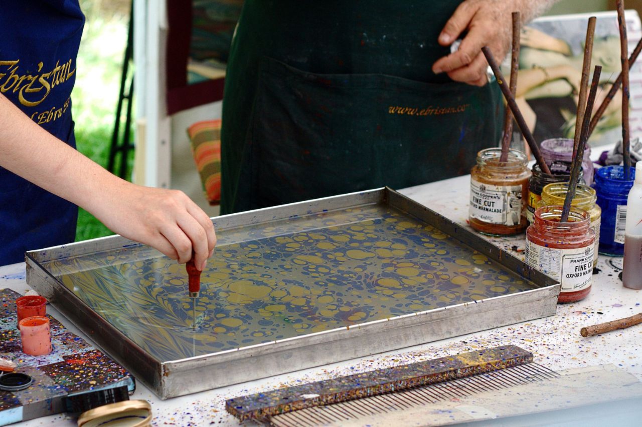 Florentine artisans prepare marbled paper goods for their customers.