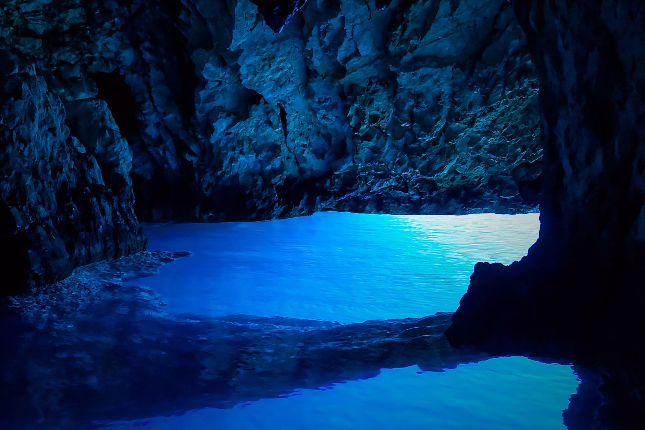 The blue water and rock formations inside the cave on the Amalfi coast, near Naples.