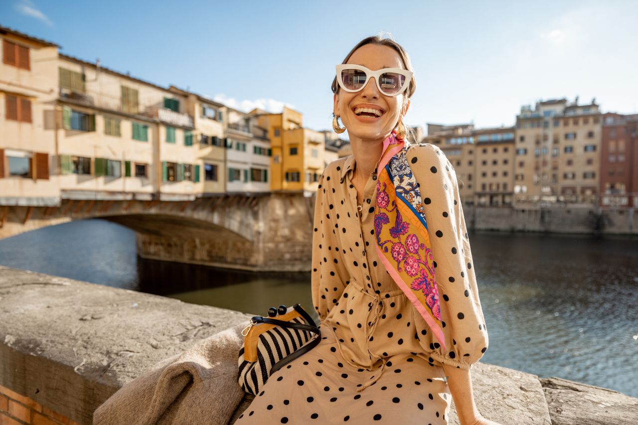 A tourist enjoys the place of Florence, Italy with summer attire.