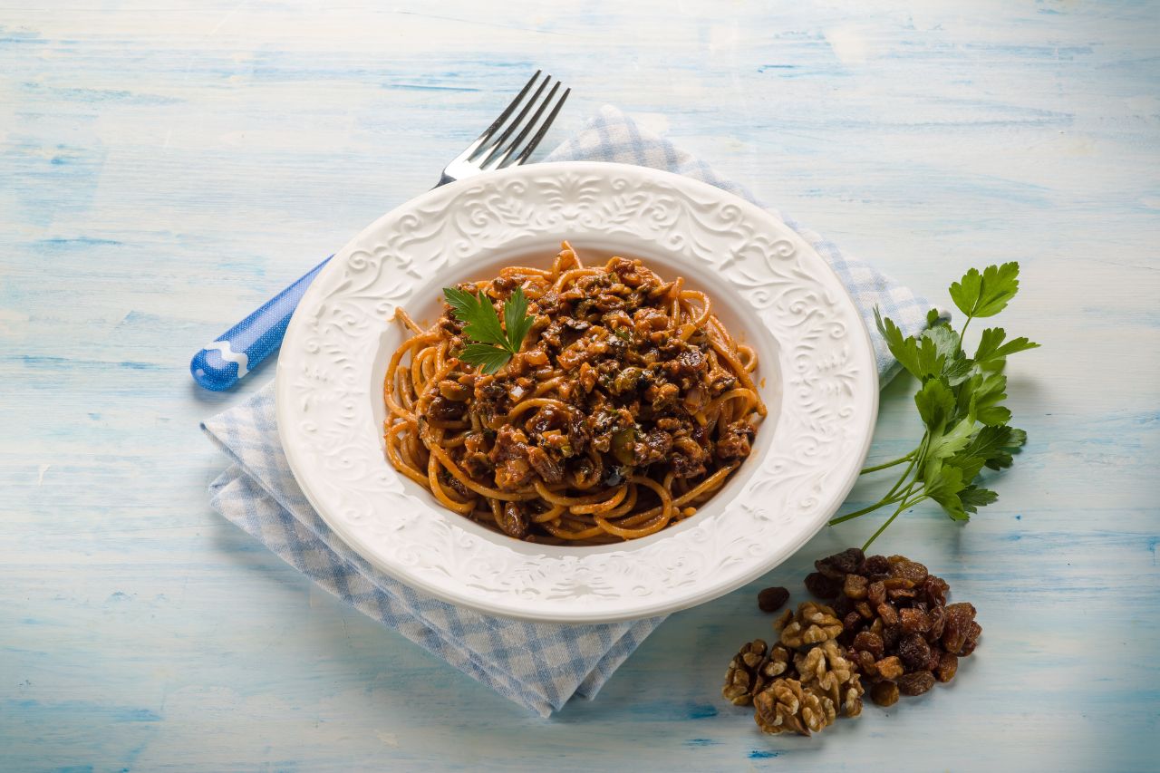 A delicious Spaghetti con le noci with walnuts on plate. 