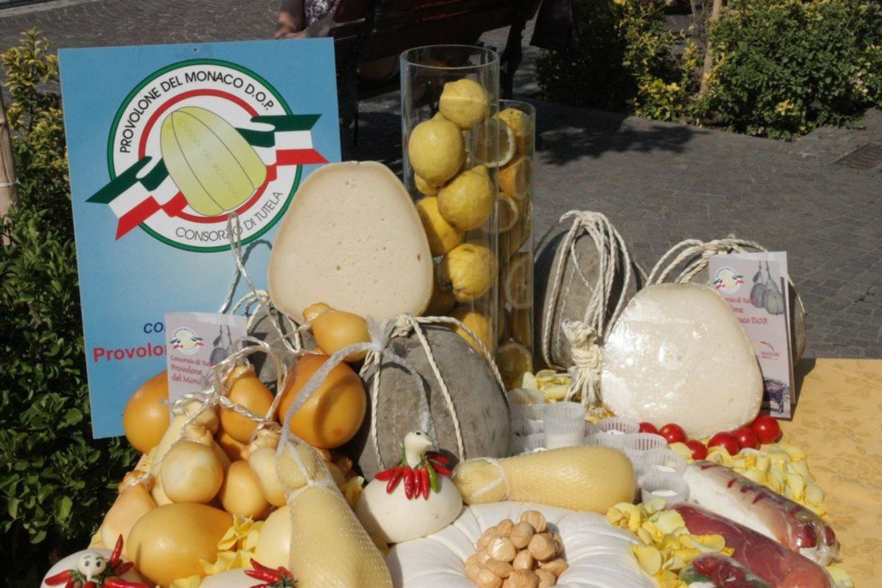 A Provolone del Monaco cheese with fruits and vegetables