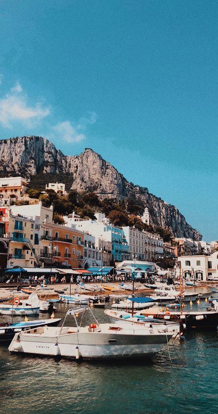 Some wealthy people have moored their boats on the Capri marina