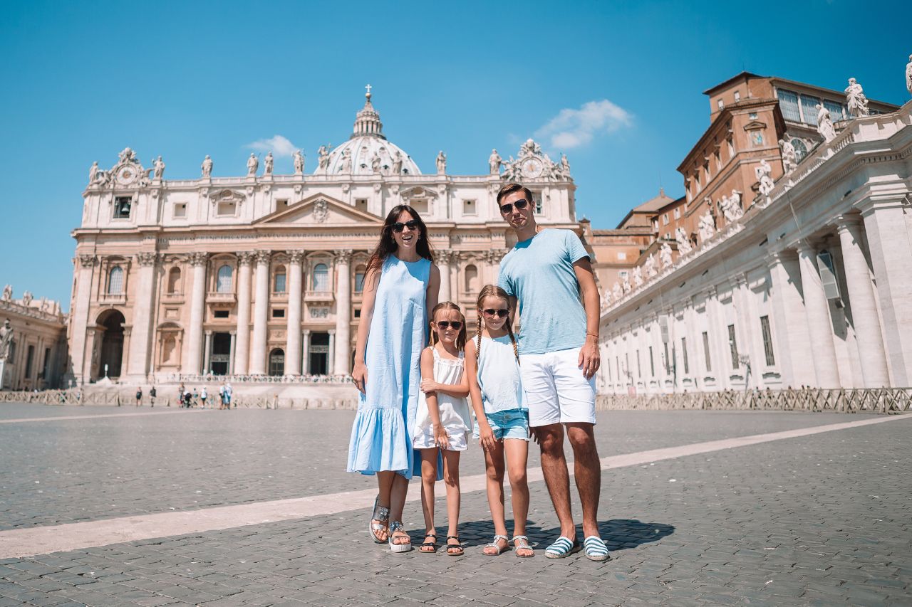 Happy family wore appropriate clothes to visit the Church of San Pietro in Rome.