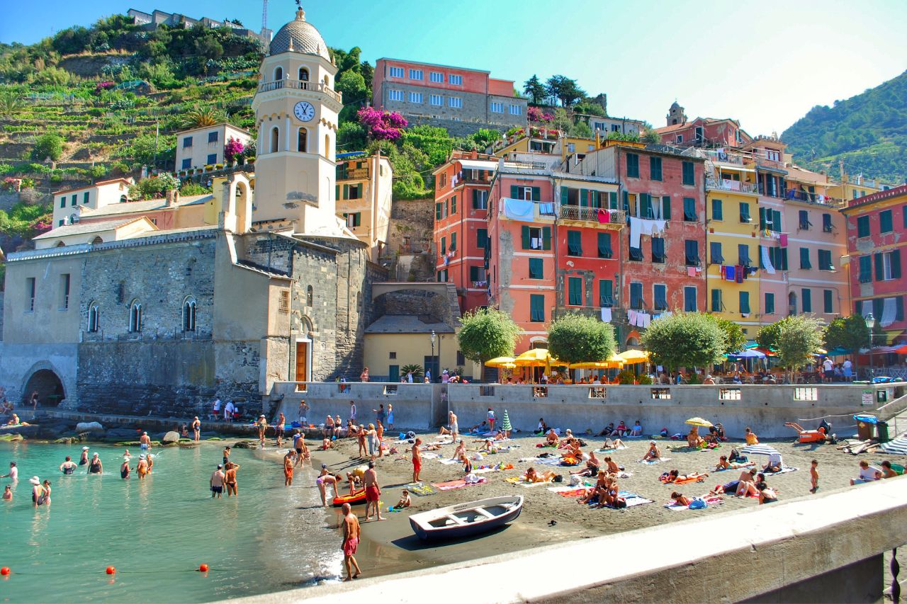 Tourist enjoys swimming at the beach of the Amalfi coast.