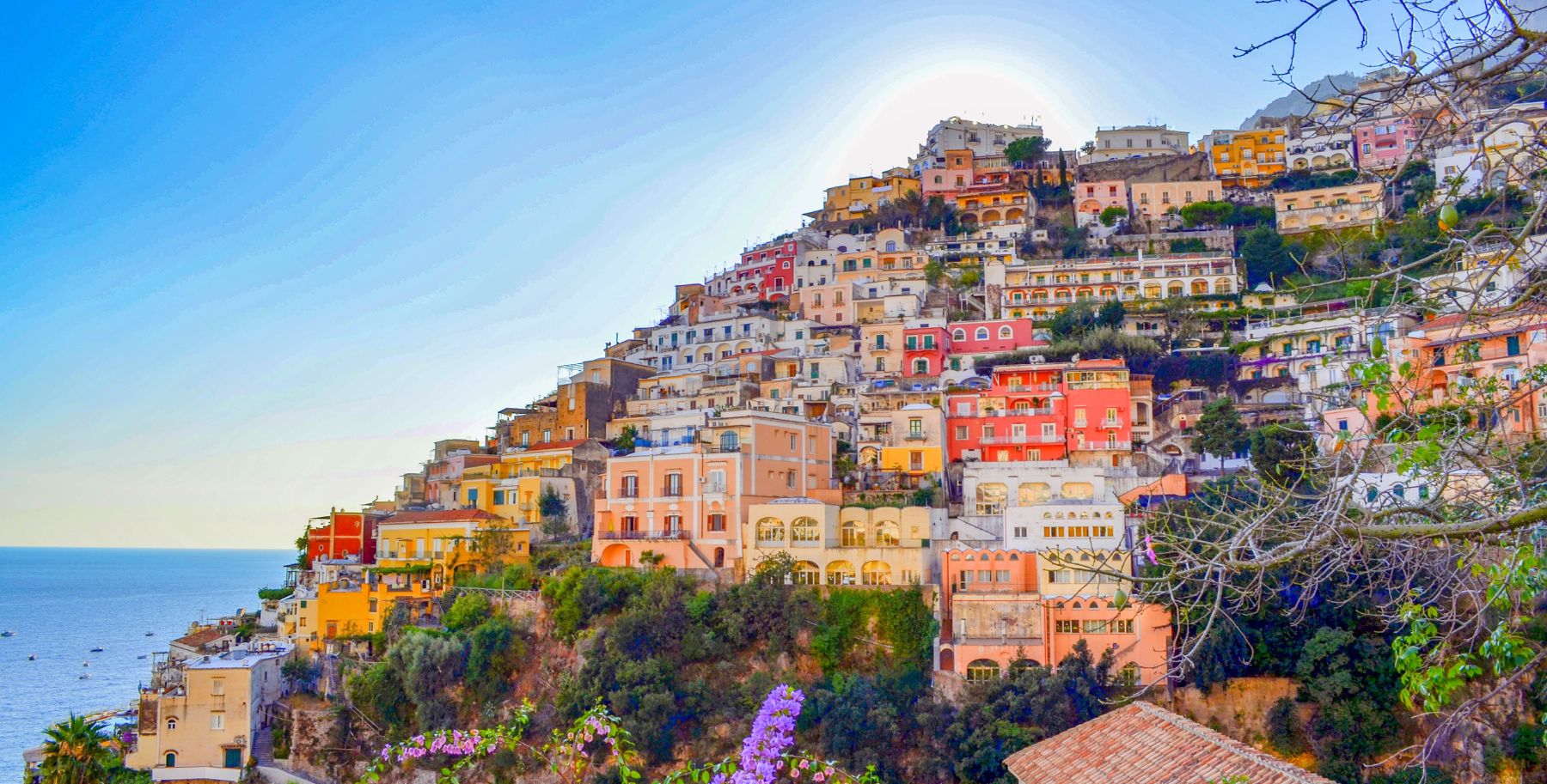 Colorful houses on the rocky mountain with stunning views of the sea in Positano.