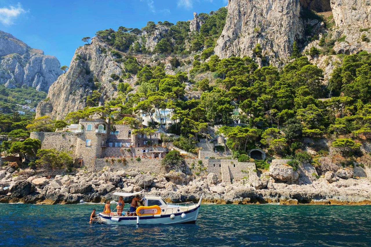 Family of tourists enjoy the Capri Island boat tour.