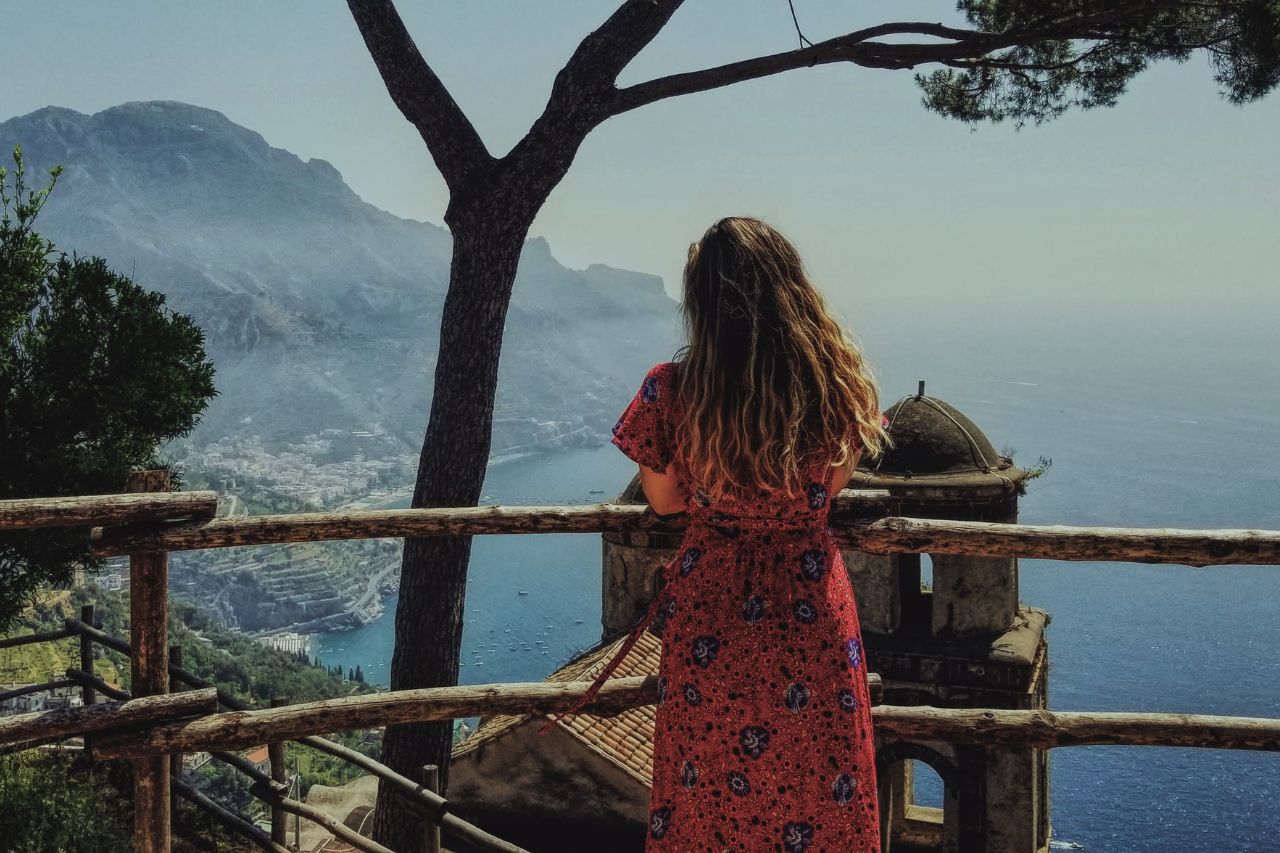 A tourist enjoys the relaxing view of the sea from Ravello.