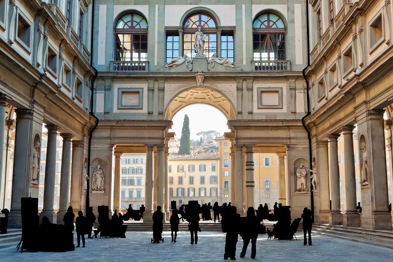 Tourists are entering the Uffizi gallery in winter, Tuscany