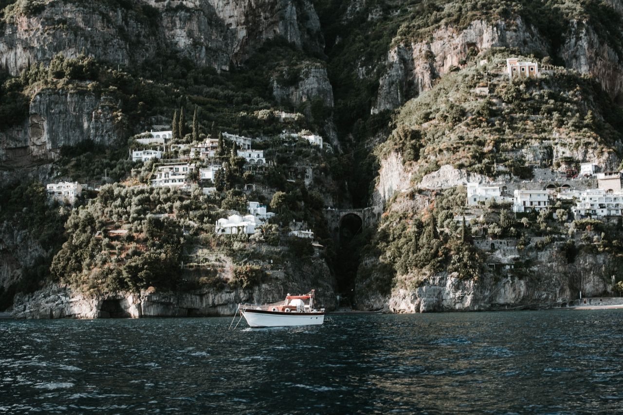 From the boat, the view of the cliffs with houses on the Amalfi coast.