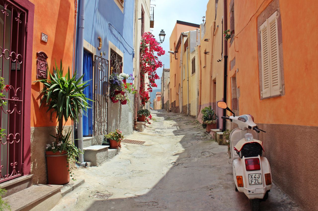 A Vespa parked in a village alley on the Amalfi coast