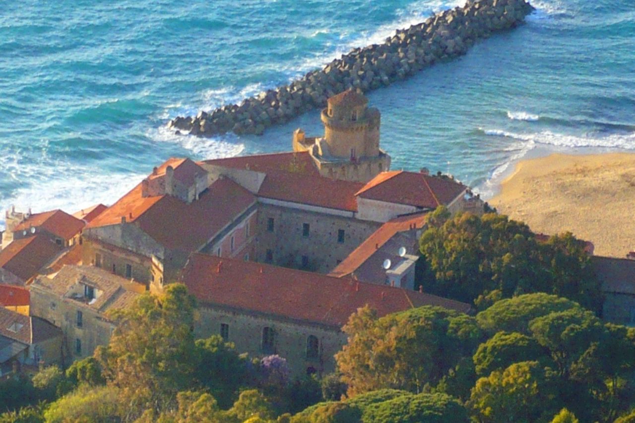 Aerial view of the Palace of the Princes of Belmonte near the sea.