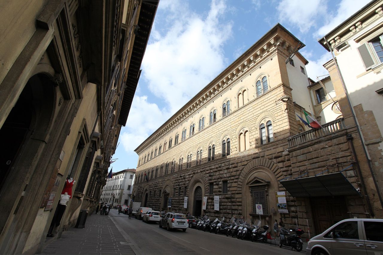 The Riccardi Medici Palace on a busy street in Italy