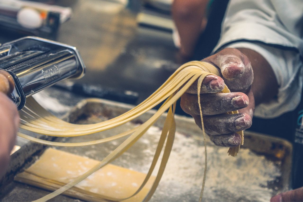 A chef shows how to make pasta in a restaurant in Tuscany.