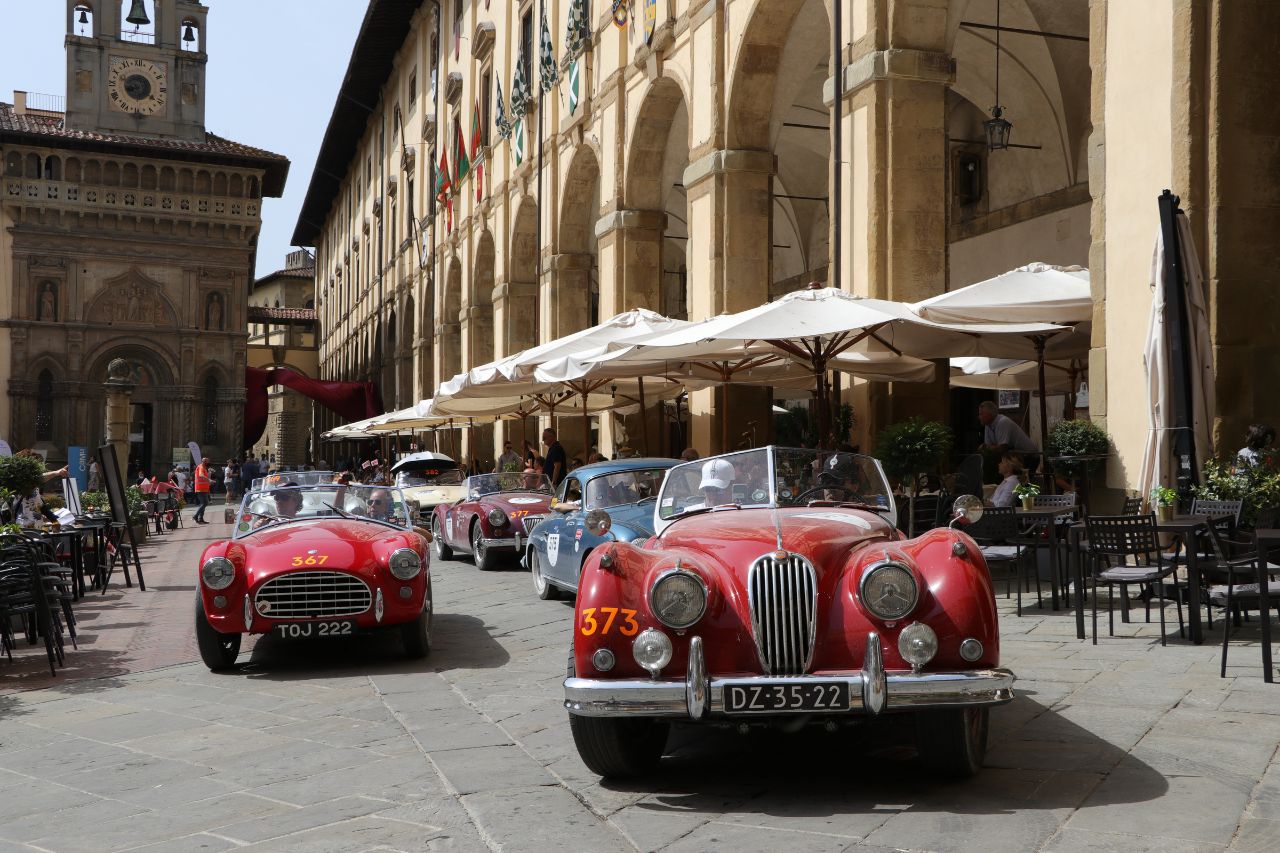 Vendors selling vintage and antique items, like these cars in Arezzo.