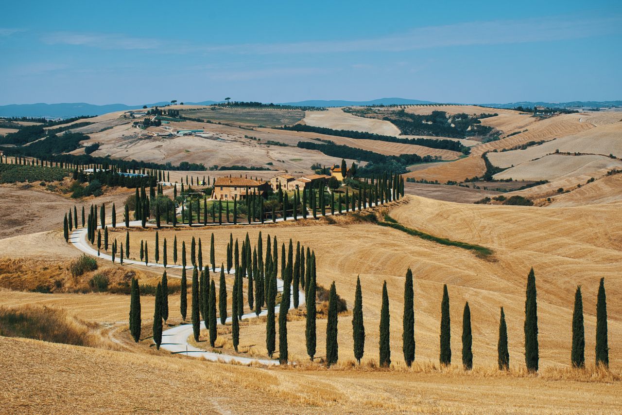 This is the iconic valley of rolling hills and cypress trees in Val D'Orcia