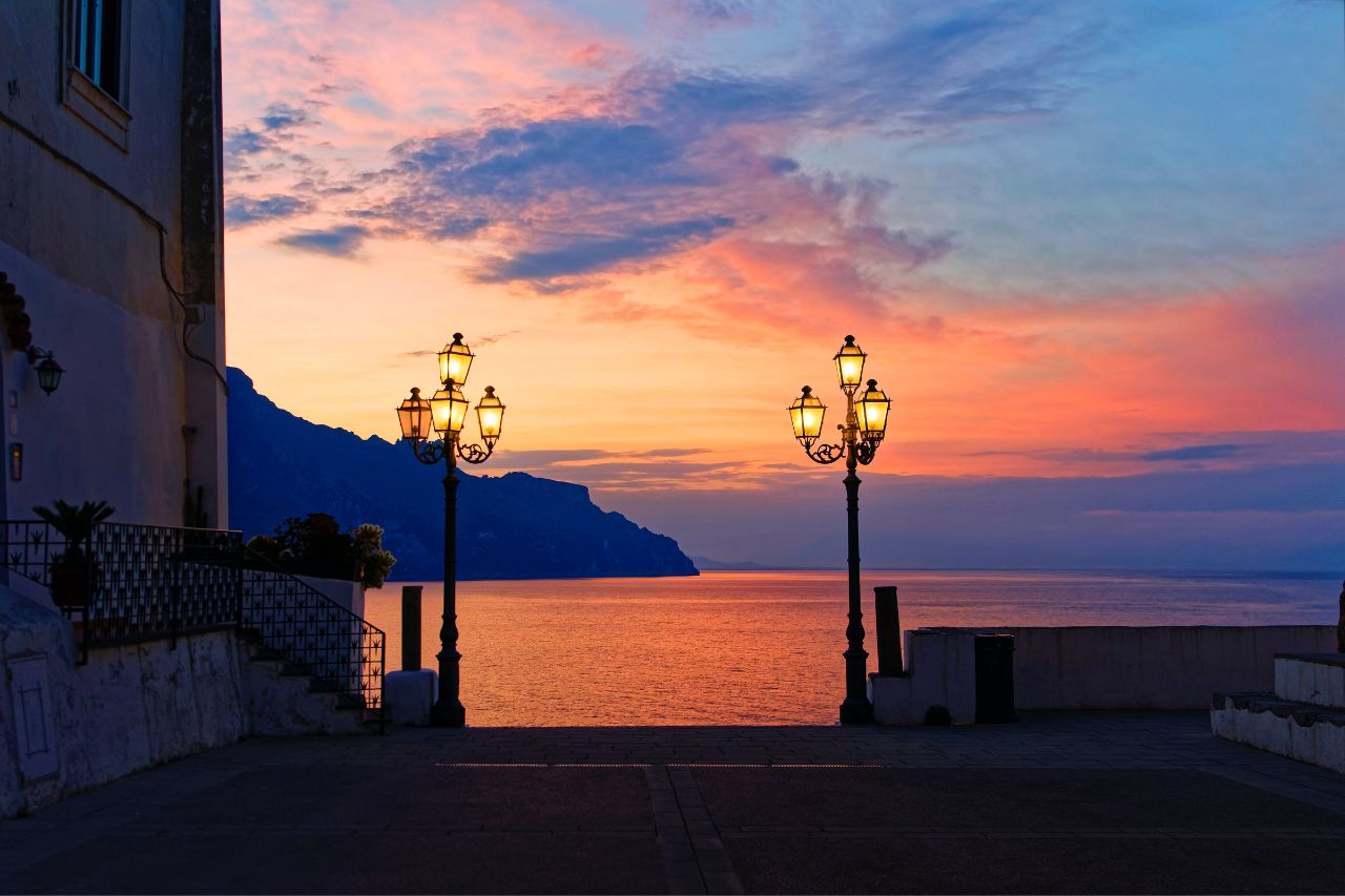 A night view of the sea with beautiful sunset and colorful clouds in Atrani