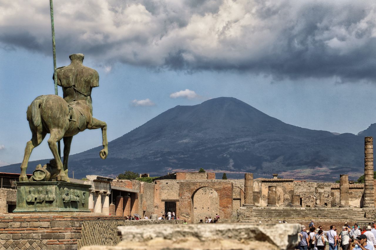 Tourists visit one of the famous archaeological sites in Pompei, near Atrani, Italy.