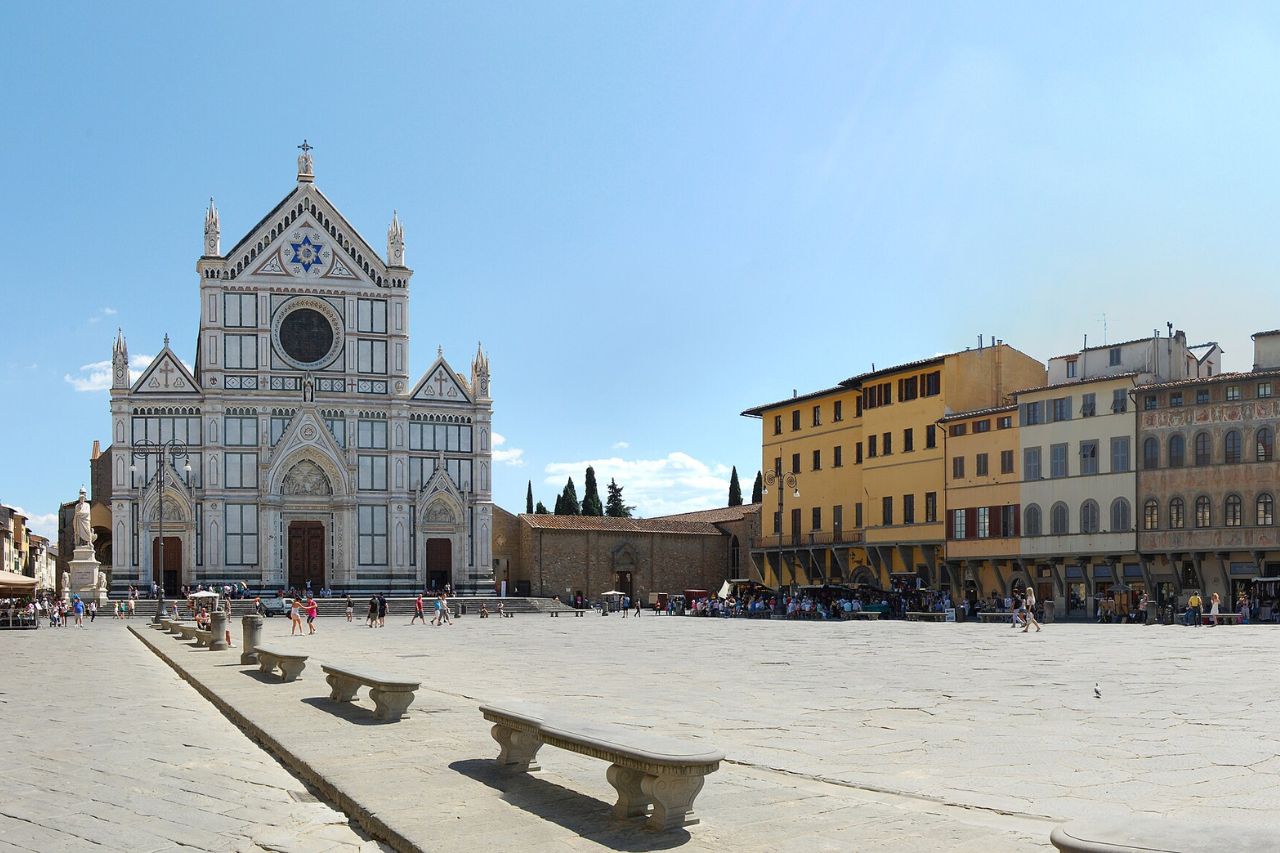 Tourists stroll in Piazza Santa Croce in Florence in February
