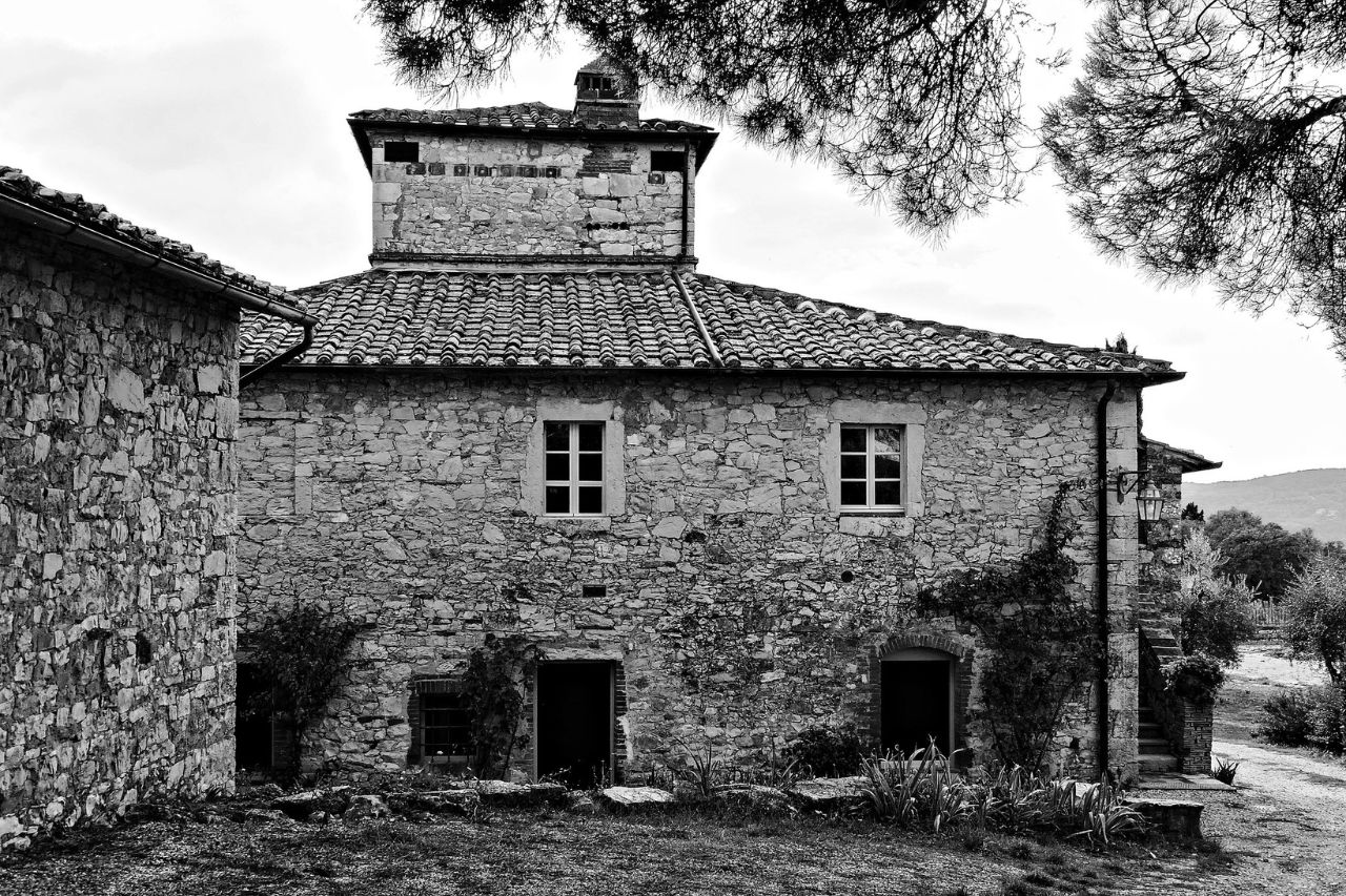 The Ama castle photographed in black and white, in Gaiole in Cianti