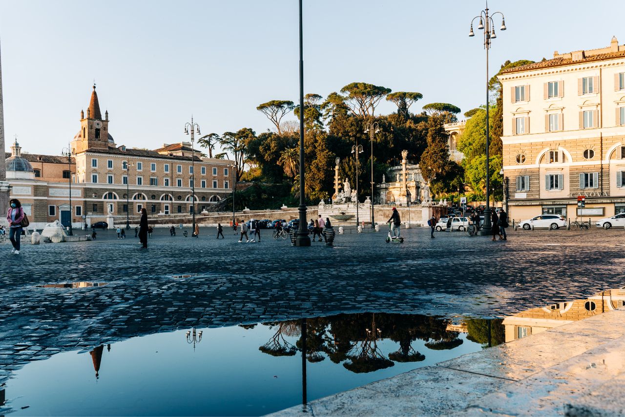 Tourists visit the Villa Borghese in Rome with sunset in the winter season.
