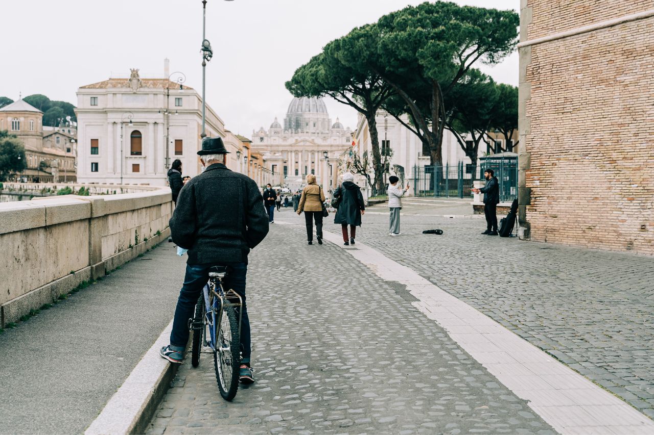 The man sits on his bike during winter in Rome, Italy.