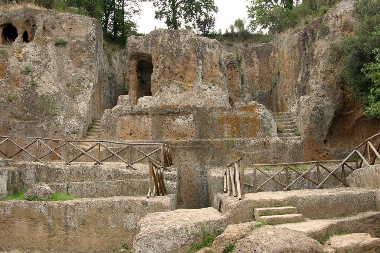 A tourist is visiting The Etruscan Necropolis of Sovana