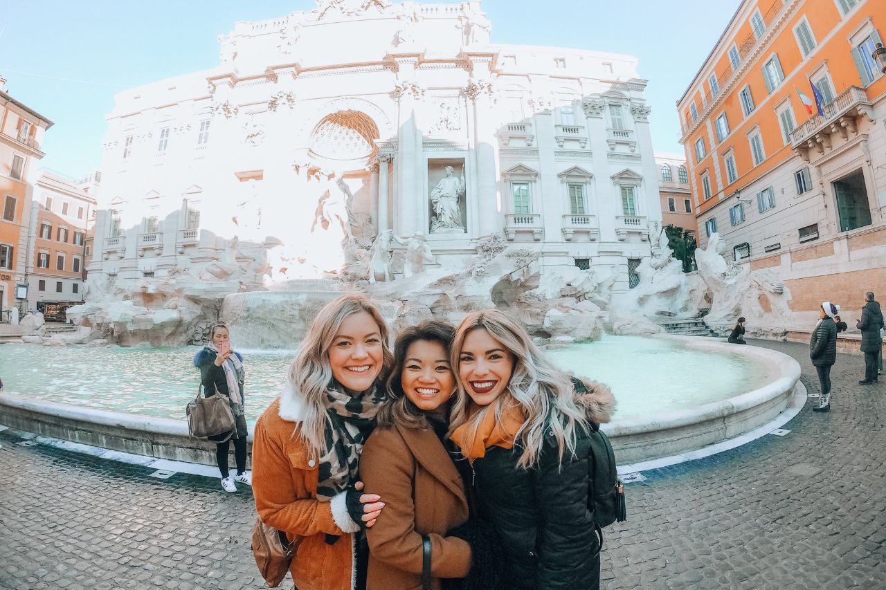 Tourists enjoy visiting the Trevi fountain in Rome, Italy.