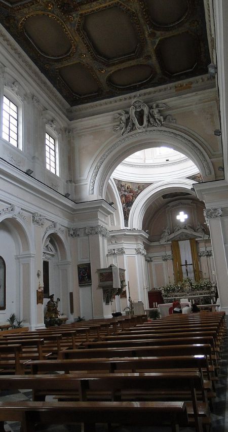 Interior view of the Church of St. John the Baptist, showcasing the ornate decor and religious symbolism within.