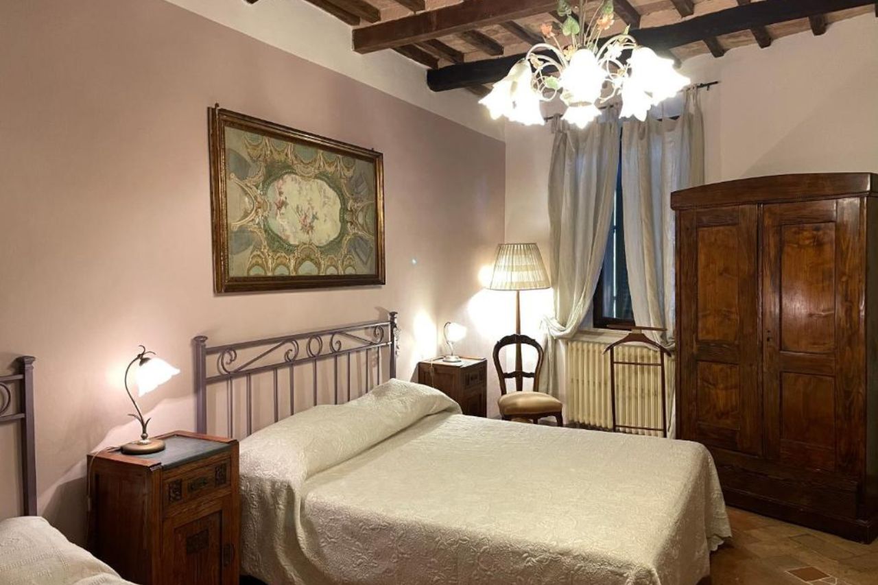 Inside bedroom of renovated historic building with comfortable atmosphere located at the B&B Da Idolina