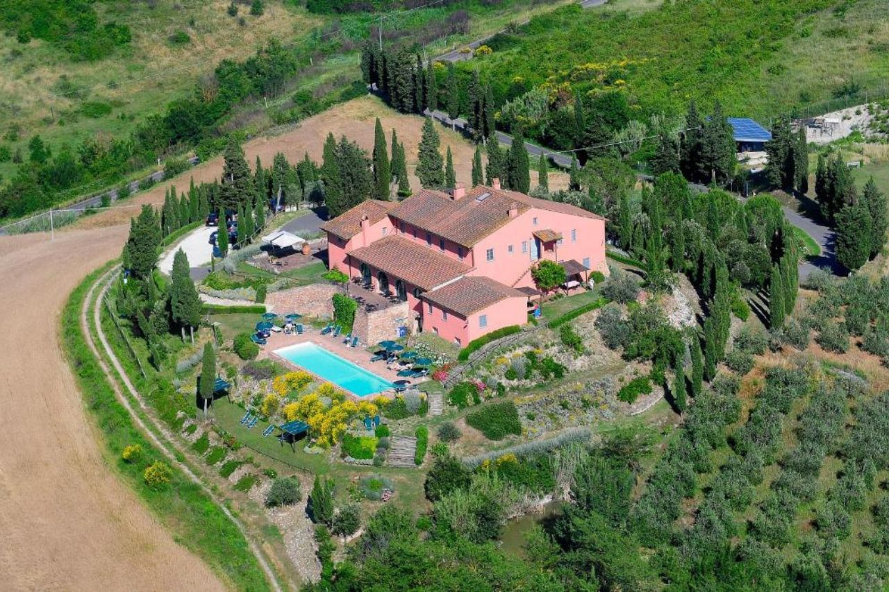Aerial view of beautiful farmhouse villa with pool and beautiful landscape at Podere Benintendi