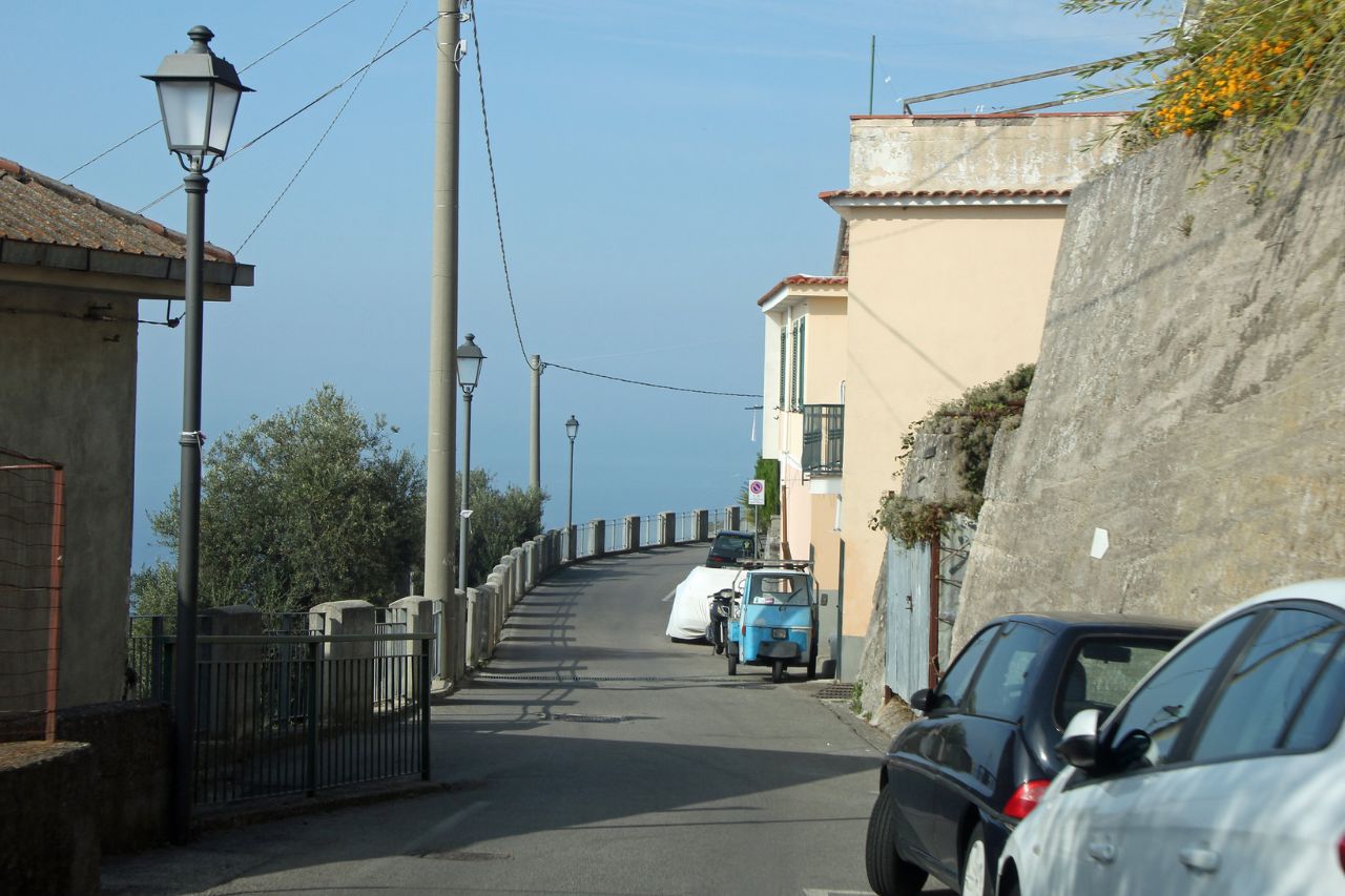 The tourists parked their cars on the narrow road on the Amalfi coast