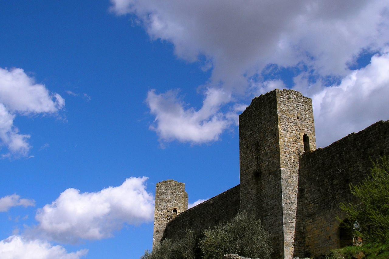 The walls of the Monteriggioni castle seen from below