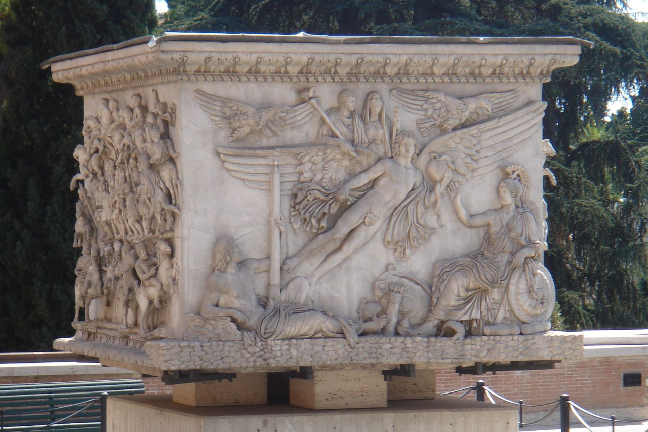 "Antoninus Pius’ Column - A close-up of the ancient Roman monument, featuring intricate reliefs illustrating events from the reign of Emperor Antoninus Pius."