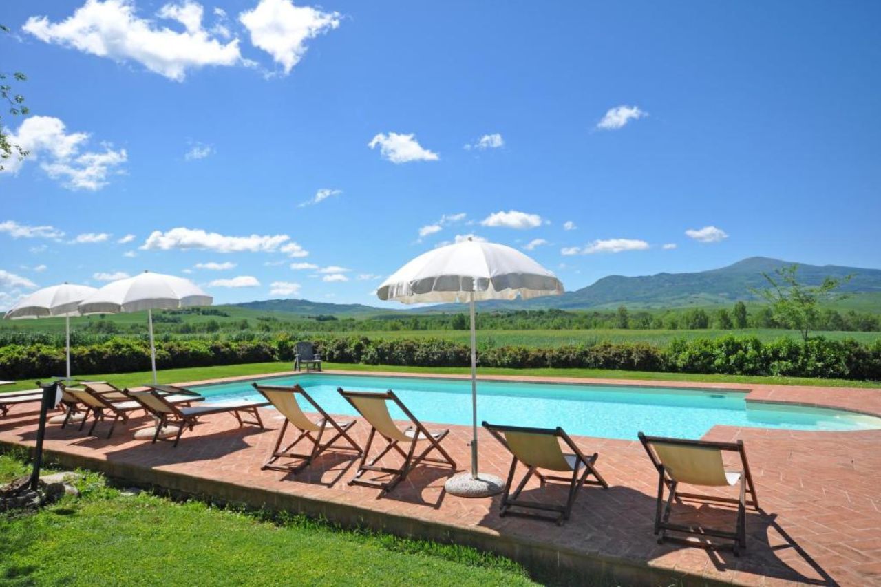 Outdoor swimming pool with breathtaking landscape view located Pienza, Italy